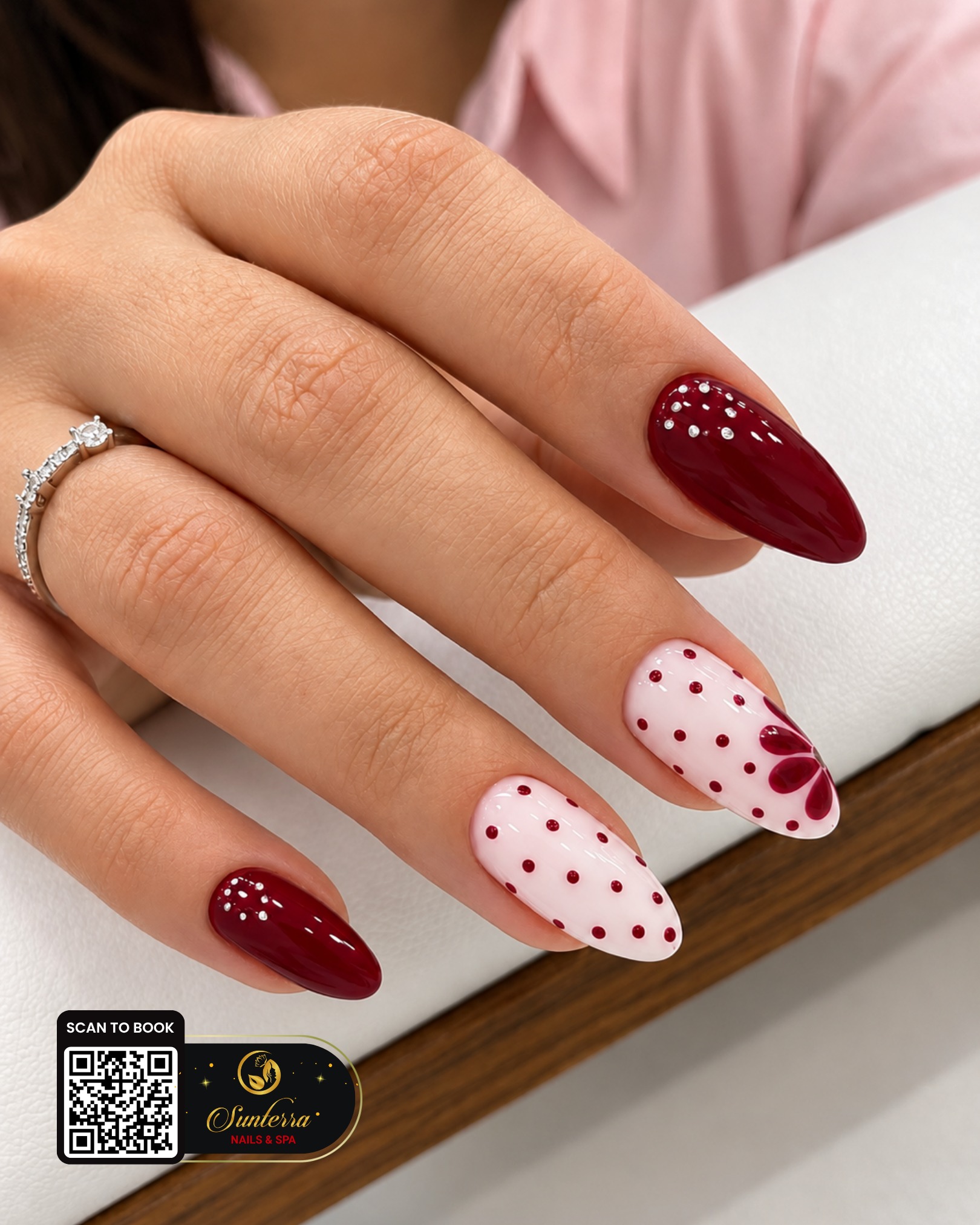 Cherry wine and polka dot nails shared by Sunterra Nails & Spa on Instagram